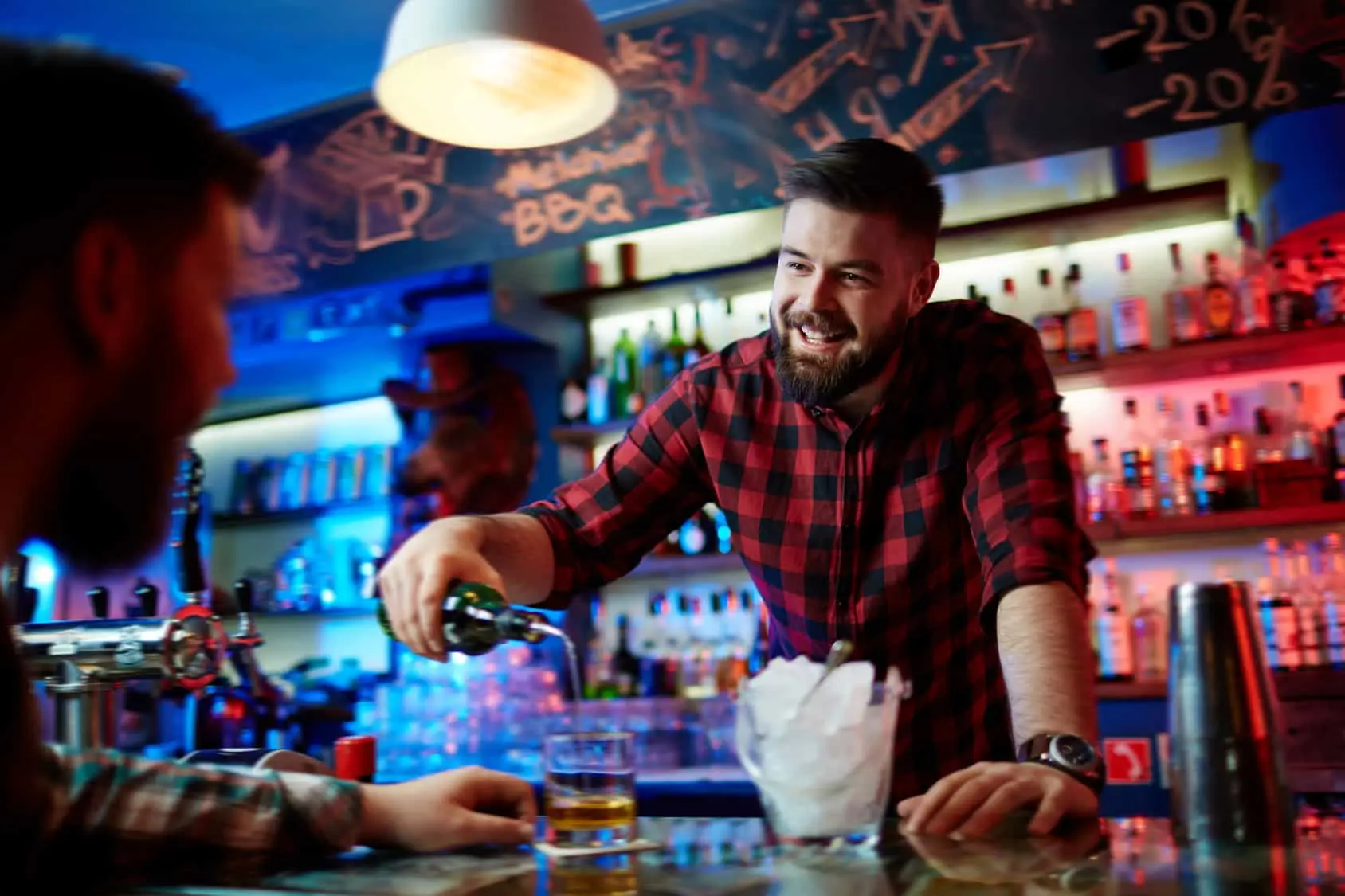 Barman pouring whiskey office scenting